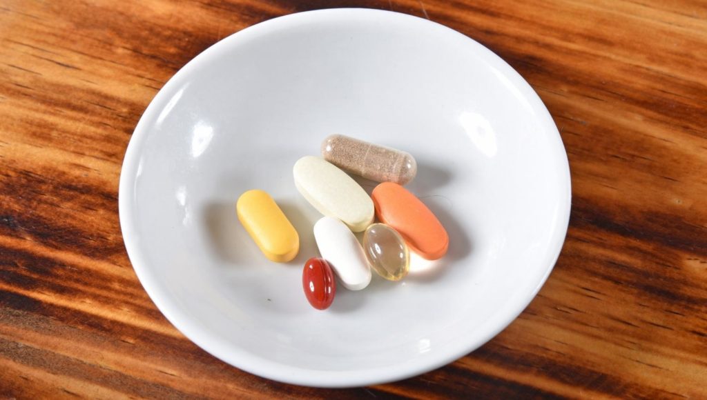 Various vitamins on plate